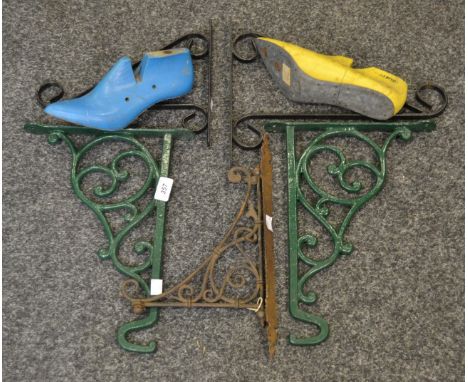 A cast iron wall bracket, a similar pair; a shoe last; etc