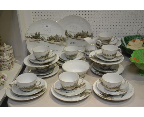 A Japanese part tea service painted with Mount Fuji and a pair of Ducks in the foreground