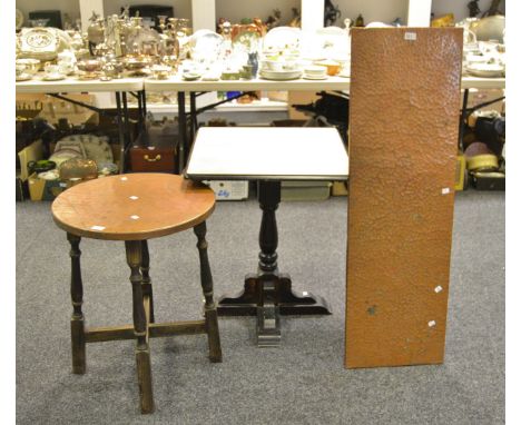 An early 20th century oak circular occasional table, beaten copper top, X-stretcher; a contemporary oak pub table, turned sup