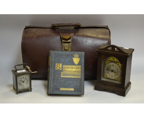 A leather Gladstone bag; a French carriage clock; an early 20th Century oak carriage clock; English scenery book dated 1890 (