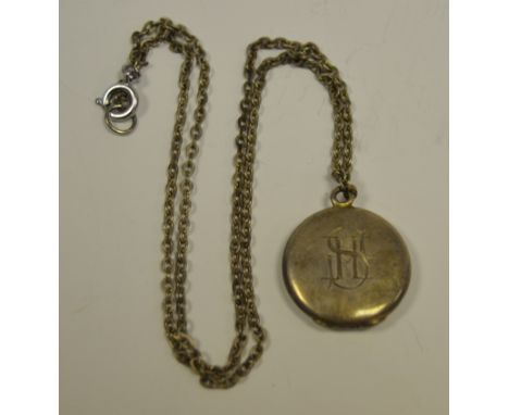 An early 20th century silver and enamel locket pendant and chain