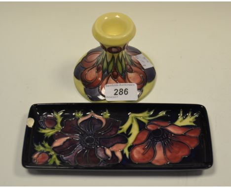 A contemporary Moorcroft Trial boudoir candlestick,  designed by Emma Bossons, tube lined with stylised tulips, in red and pu