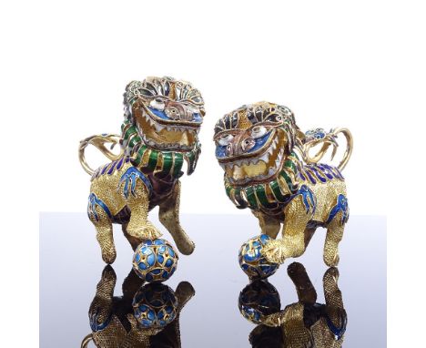 A pair of Chinese silver-gilt and enamel Dogs of Fo, length 8cm 