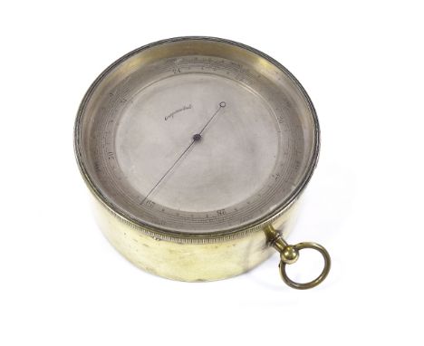 A Victorian brass drum-cased barometer with silvered dial, diameter 12cm, and an unusual Middle Eastern engraved brass rule (