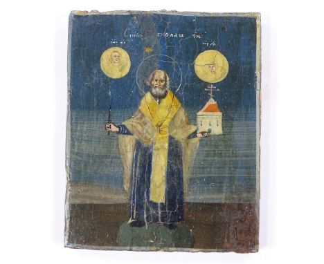 A Greek hand painted icon on wood panel, depicting a saint, with text inscription and wax collection seal on reverse, 11cm x 