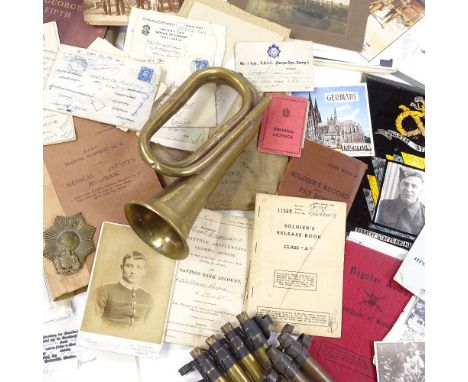 A group of militaria, including brass bugle, booklets, ephemera etc 