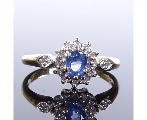 An unmarked gold sapphire and diamond cluster ring, diamond set shoulders, settings test as 9ct, total diamond content approx