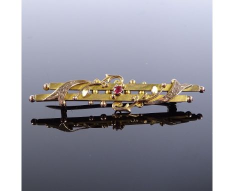 A Victorian 9ct gold ruby double-bar brooch, brooch length 47.4mm, 2.1g Good overall condition, no damage, backs of beads hav