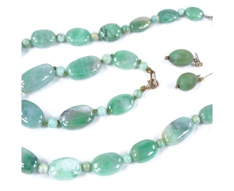 A modern polished jade and composition demi-parure, comprising jade necklace and bracelet with composition earrings, necklace