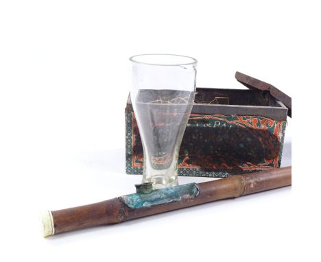 A Chinese bamboo and ivory-tipped opium pipe with glass chimney, length 56cm 