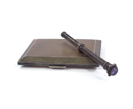 A George V Art Deco small rectangular silver cigarette case, bevelled edges with engine turned decoration and gilt interior, 