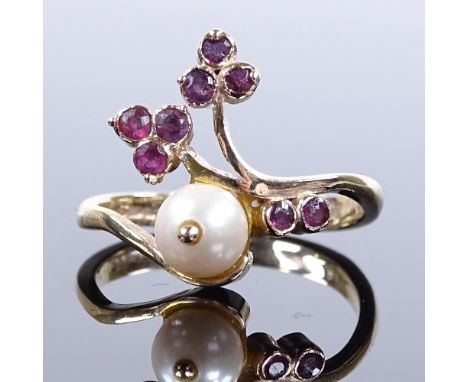 A 9ct gold ruby and cultured pearl floral ring, maker's marks EF, hallmarks London 1987, setting height 15.1mm, size L, 2.7g 