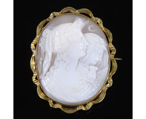 A Victorian relief carved cameo shell panel brooch, depicting Greek goddesses Eos and Nyx, in unmarked gilt-metal frame, broo