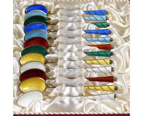 A set of 12 Egon Lauridsen Danish vermeil silver and harlequin enamel coffee spoons, shell pattern bowls and striped handles,