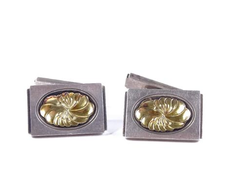 A pair of Georg Jensen Danish sterling silver cufflinks, central floral vermeil panels, model no. 59A, import marks London 19