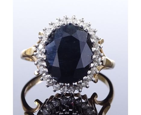 A 9ct gold sapphire and diamond cluster ring, maker's marks GJ, hallmarks Birmingham 1988, setting height 16.1mm, size R, 4g 