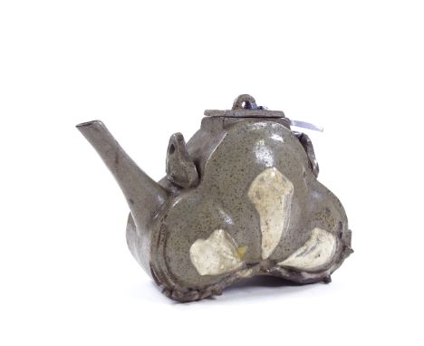 A Chinese glazed terracotta teapot with slip text inscription, height 14cm Tiny chip on the foot, hairline crack on both side