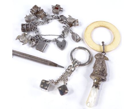 Various silver and jewellery, including charm bracelet, bunny rattle, and silver propelling pencil Lot sold as seen unless sp