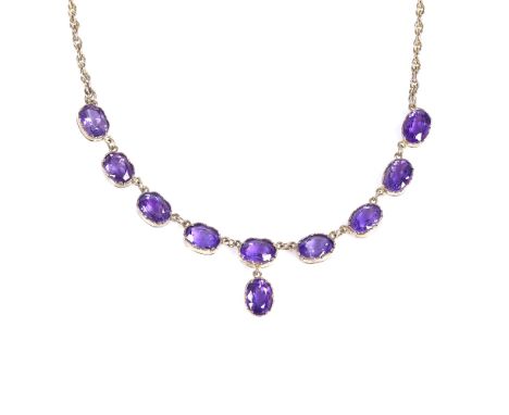 A 9ct gold amethyst line collar necklace, necklace length 45cm, 11.4g Very good overall condition, all stones present with no
