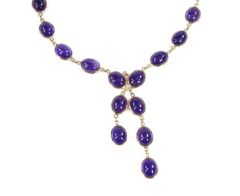 A modern unmarked gold cabochon amethyst line negligee necklace, with 2 graduated drops, unmarked settings test as 18ct gold,
