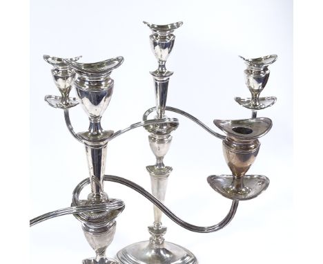 A pair of Edwardian silver three light candelabra, marquise form with removable sconces, central single light and two branche