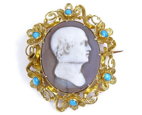 A Victorian relief carved cameo panel brooch, depicting male profile, in unmarked yellow metal floral setting with inset turq