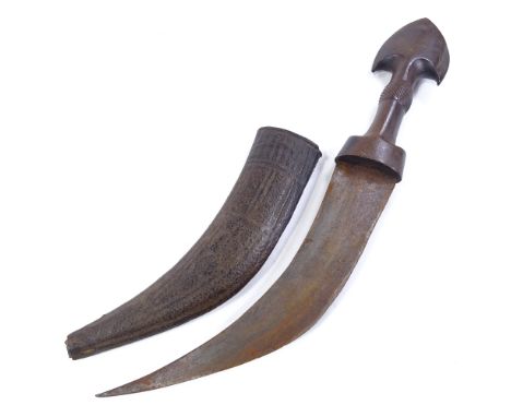 An Antique Arab dagger with carved and shaped horn handle, original leather-covered scabbard, overall length 40cm Handle has 