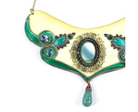 An Art Nouveau brass coloured enamel and stone set bib necklace, with central green lace agate and green stone drop, necklace