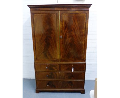 An Edwardian Maple & Co mahogany and inlaid linen press, the cornice with dentil frieze over a pair of cupboard doors, openin
