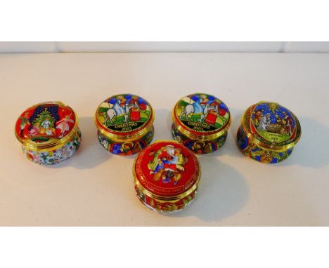 A collection of five Halcyon Days enamel Christmas boxes dated 2000, 2001, 2002, and two from 2003, (5) 