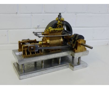 A modern brass and metal scale model of a single cylinder beam engine