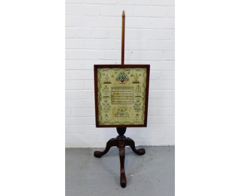 A mahogany pole screen with Regency sampler insert worked by Frances Jordan, 1828, finished in her ninth year, on a leaf carv