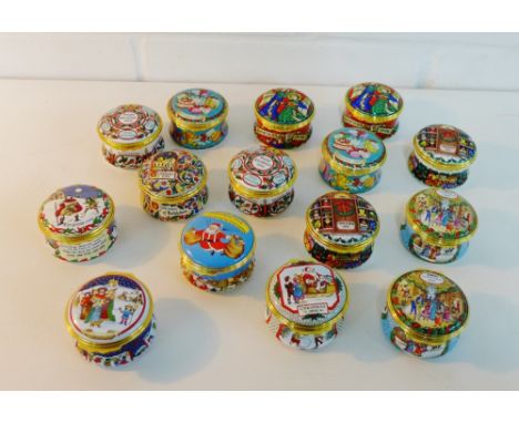 A collection of fifteen Halcyon Days enamel Christmas boxes dating to the 1990's (15) 