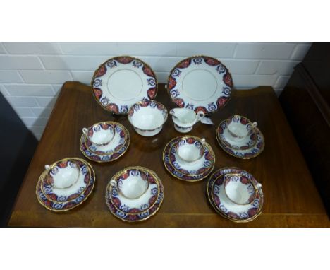 E. Hughes & Co bone china twelve place teaset, comprising twelve tea cups, twelve saucers, twelve side plates, two cake plate