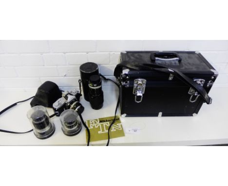 A Nikkormat vintage camera together with a collection of Nikon lenses, complete with a vinyl carry case (4) 