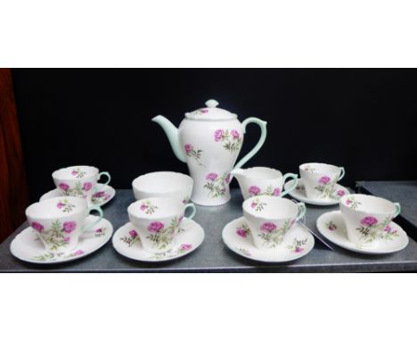 A Shelley porcelain tea set, white ground painted with pink rose sprays comprising coffee pot, cream jug, sugar bowl, set of 