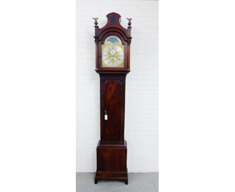 A George III mahogany longcase clock, the domed hood over a 12 inch brass dial, inscribed Thos Hutchinson, Leeds, with sun an