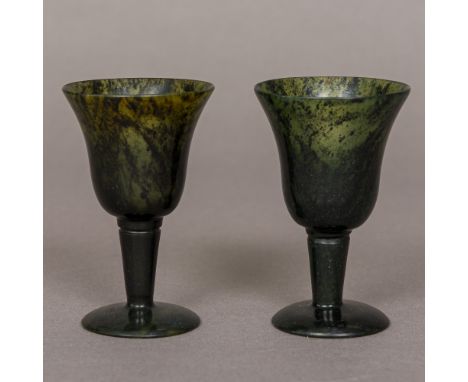 A pair of spinach jade goblets Each of diminutive size with flared bowl and domed foot. Each 8 cm high. (2) CONDITION REPORTS