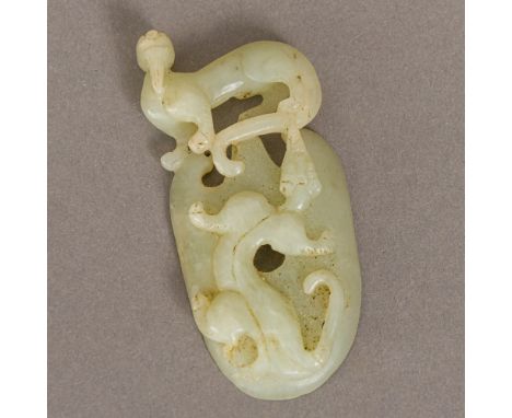 A Chinese celadon jade carvingDepicting a dragon and a dog-of-fo.  7.5 cm high.  CONDITION REPORTS: Generally in good conditi