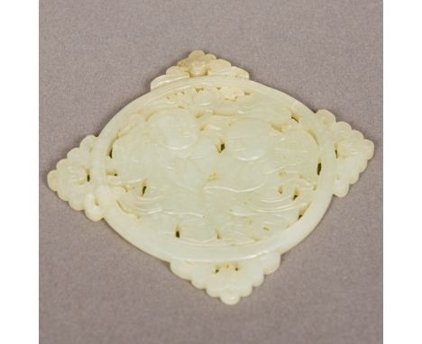 A Chinese pierced and carved jade roundelCentrally decorated with two young boys, one holding a lantern flanked by four pierc