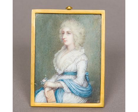 An 18th century portrait miniature on ivory Depicting an elegant lady in a white dress and blue shawl, initialled MF and date