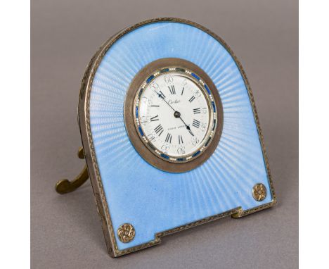 A Cartier guilloche enamel decorated silver strutt clockThe white enamelled dial with Roman and Arabic numerals inscribed Car