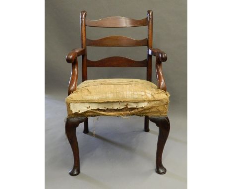 An 18th century mahogany ladder back open armchairThe three curved back splats supported by carved uprights issuing twin open