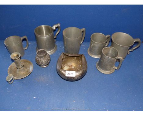 A quantity of Pewter tankards, candlestick and pot.