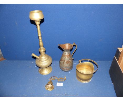 An Eastern brass hookah pipe, jug, bell and miniature coat scuttle.