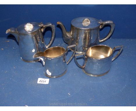 A Walker &amp; Hall, Sheffield four piece plated Teaset comprising teapot, hot water pot, milk jug and sugar bowl. 