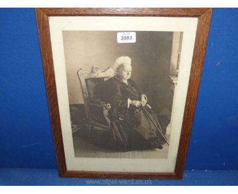 An Oak framed copyright Print of Photograph by Russell &amp; Sons., Baker Street depicting Queen Victoria, attached verso is 