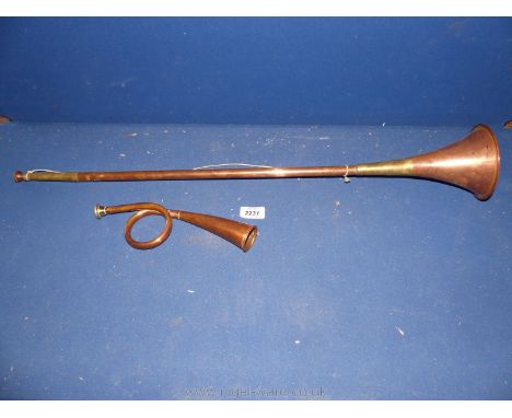 A vintage coiled copper Hunting Bugle and a copper hunting horn.