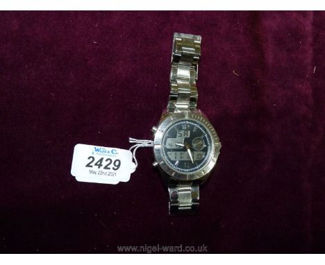 A heavy polished finish ''Executive Elite'' quartz movement Wristwatch having black grid pattern face with luminous hands and