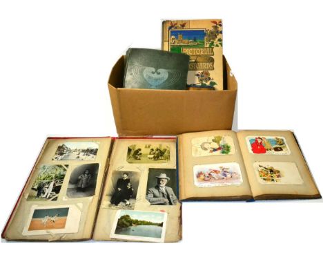 Four Vintage Postcard Albums with a varied collection of world used and unused cards including topographical, real photograph